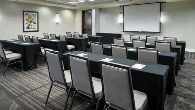 Meeting room at Hilton Garden Inn DFW, elegant tables for corporate events and training.