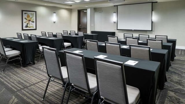 Meeting room at Hilton Garden Inn DFW, elegant tables for corporate events and training.
