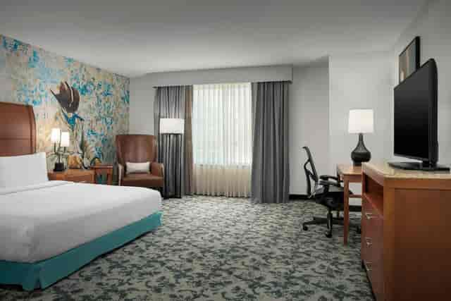 Trinity I hotel room at Hilton Garden Inn, spacious layout for events and meetings.