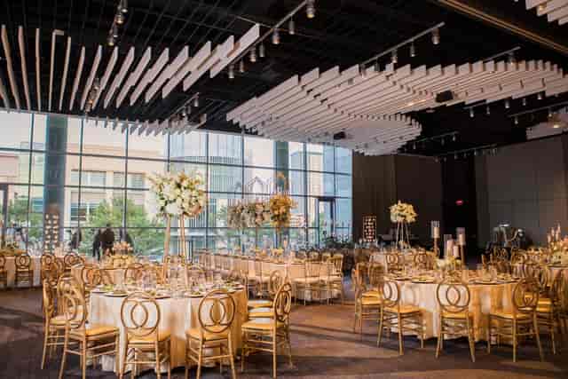 Elegant ballroom with round tables, ideal for weddings and corporate events in Dallas.
