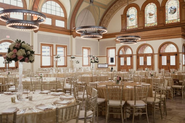 Elegant banquet hall with champagne linens, ideal for weddings and corporate events.