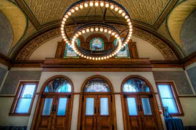 Elegant Ashton Depot venue with chandelier; ideal for upscale events and gatherings.