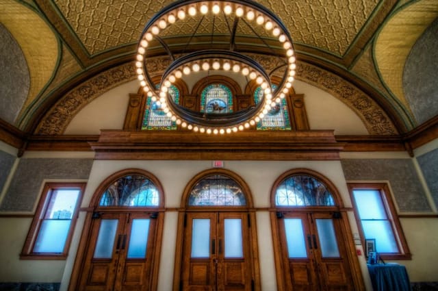 Elegant Ashton Depot venue with chandelier; ideal for upscale events and gatherings.