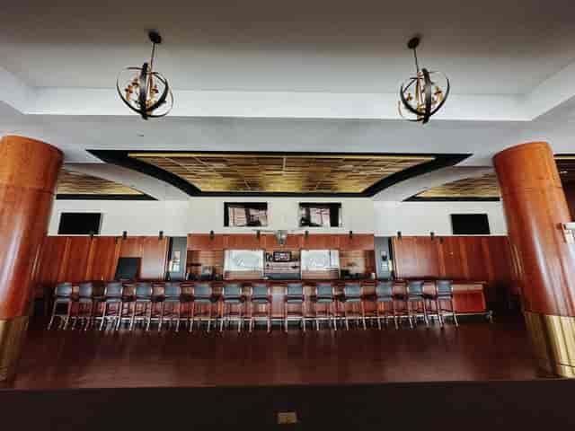 Spacious ballroom with elegant wood paneling at Texas Motor Speedway for corporate events.