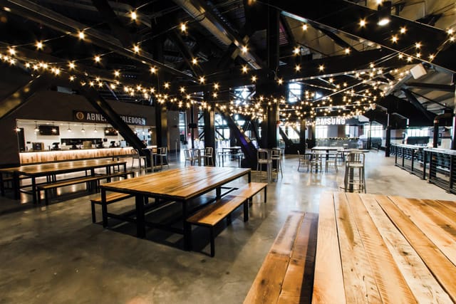 Karbach Brewing Sky Porch: industrial venue with warm lights for networking and dinner events.