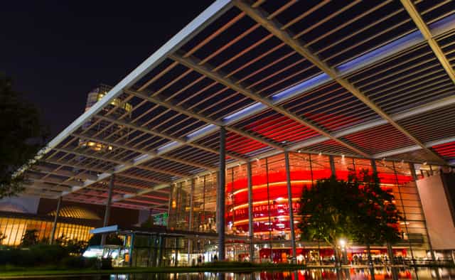 Winspear Opera House, modern red-lit venue for events and conferences in Texas.