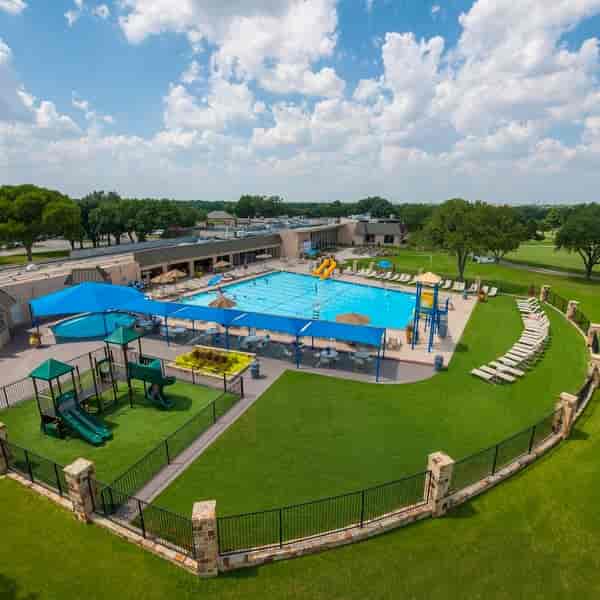Vibrant outdoor pool at Dallas Athletic Club, perfect for summer events and gatherings.