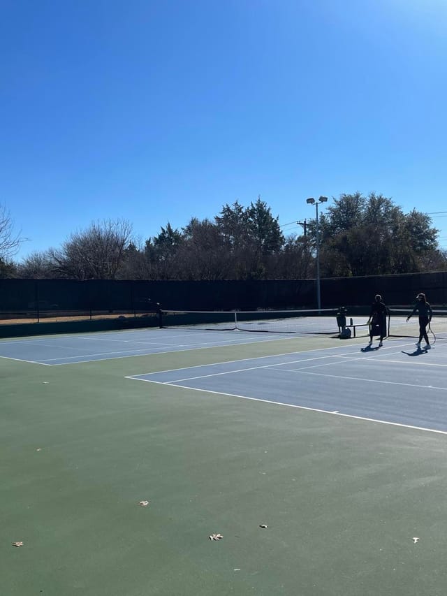 Outdoor tennis court at Dallas Athletic Club for corporate sports events and team building.