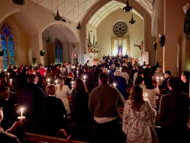 Candlelit gathering in Fellowship Hall 2 for memorial ceremonies at Kessler Park UMC.