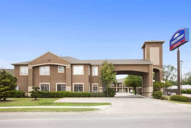 Budget-friendly hotel courtyard with welcoming entrance for meetings and events.