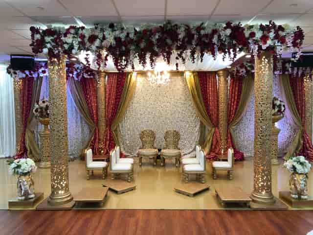 Elegant Radha Krishna Temple ballroom with floral décor, ideal for weddings and upscale events.