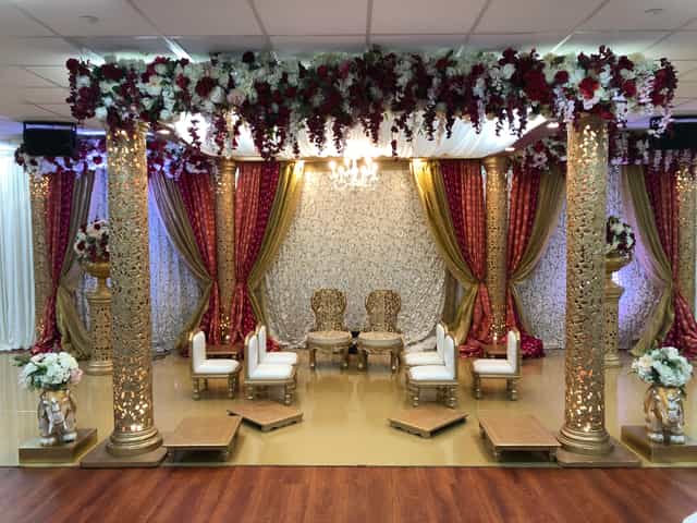 Elegant Radha Krishna Temple ballroom with floral décor, ideal for weddings and upscale events.