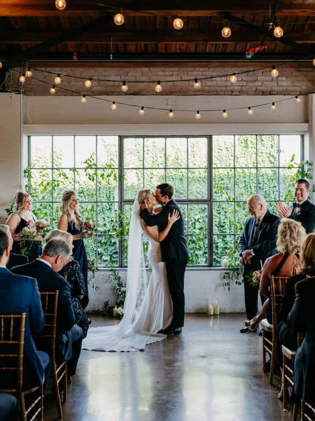 Intimate wedding ceremony in elegant Marriott Dallas/Fort Worth hall with romantic decor