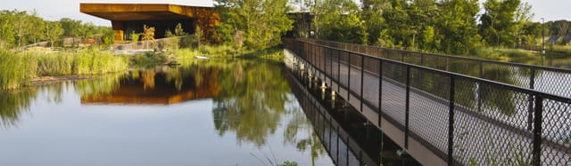Trinity River Audubon Center: serene visitor center with lush greenery for outdoor events.