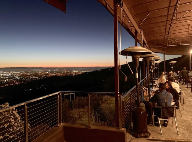 "Elegant outdoor restaurant venue with sunset views, perfect for receptions and corporate dinners."