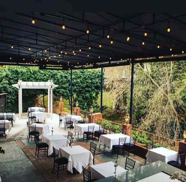 Elegant outdoor restaurant venue with string lights for intimate receptions.