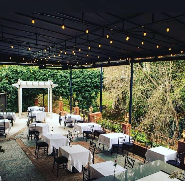 Elegant outdoor restaurant venue with string lights for intimate receptions.