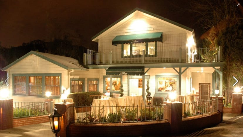 Charming La Forêt restaurant with cozy outdoor seating for upscale gatherings.