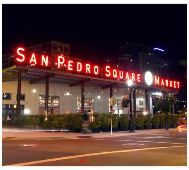 "San Pedro Square Market at night, vibrant venue for events and gatherings."