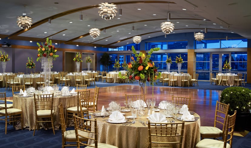 Elegant ballroom at Fairmont San Jose, set for a luxurious gala with floral arrangements.