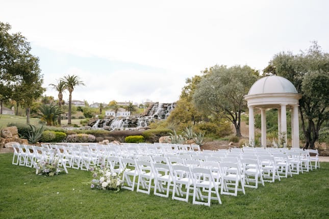Outdoor wedding venue at Silver Creek Valley CC with gazebo and lush greenery.
