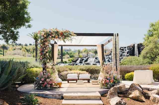 Elegant floral arch at Silver Creek Valley Country Club for weddings and upscale events.