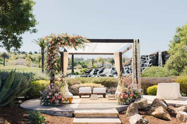 Elegant floral arch at Silver Creek Valley Country Club for weddings and upscale events.