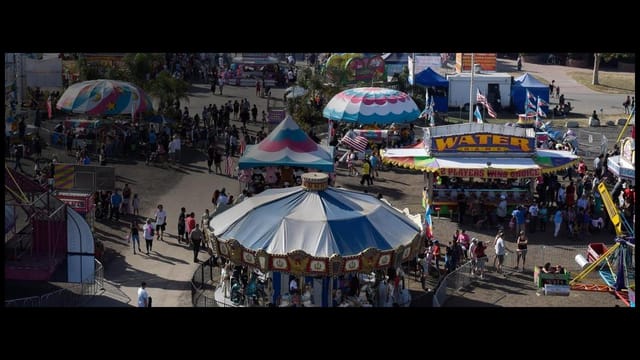 Cafeteria at The Fairgrounds with colorful carousel, ideal for family-friendly events.