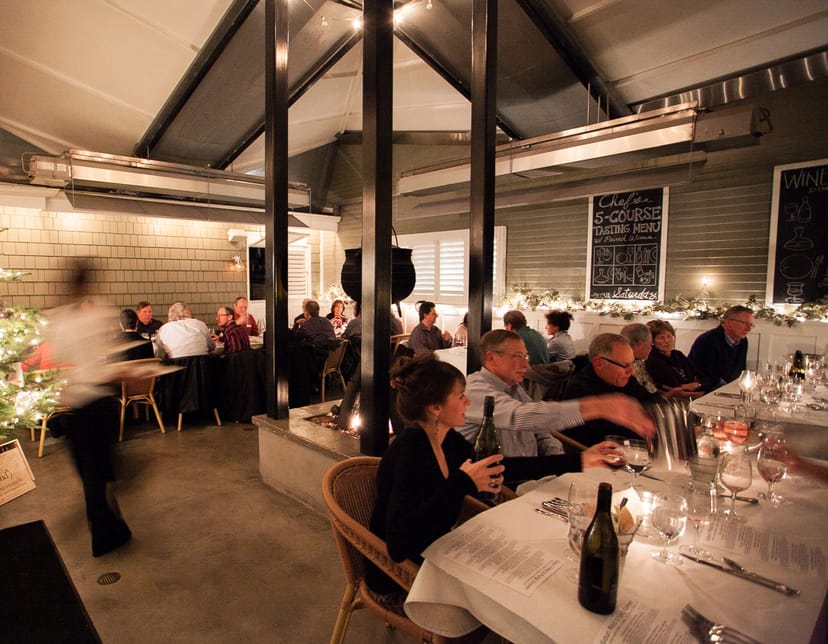 Sophisticated dining setup in Wine Vault & Bistro for upscale events and corporate dinners.