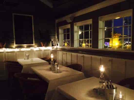Charming bistro dining space with elegant tables for intimate gatherings and events.
