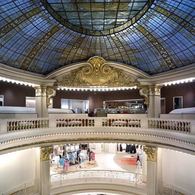 Elegant restaurant with glass dome, perfect for upscale events and networking.