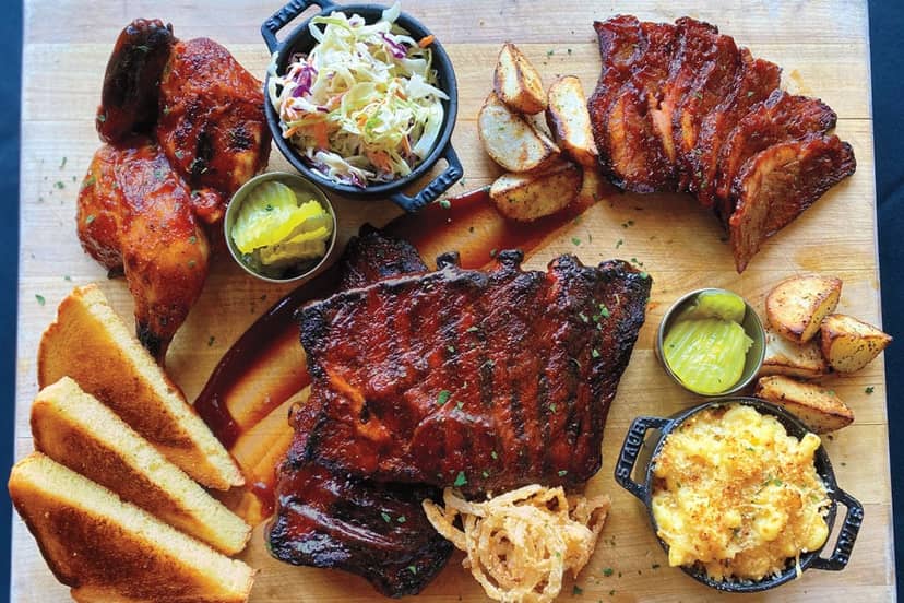 Barbecue platter with ribs and chicken at The Grille, ideal for events and gatherings.