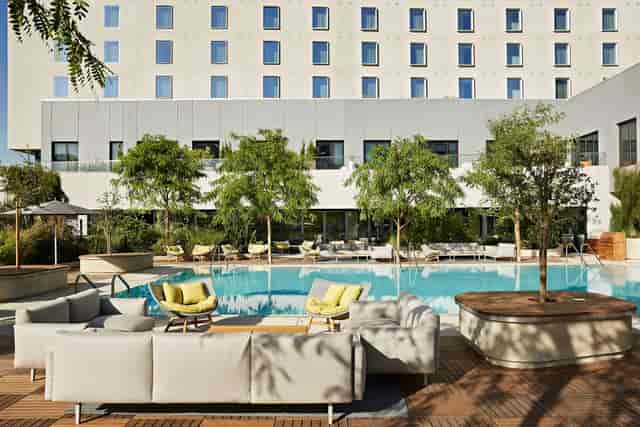 Elegant outdoor event space at Kimpton Sawyer with serene pool, ideal for gatherings.