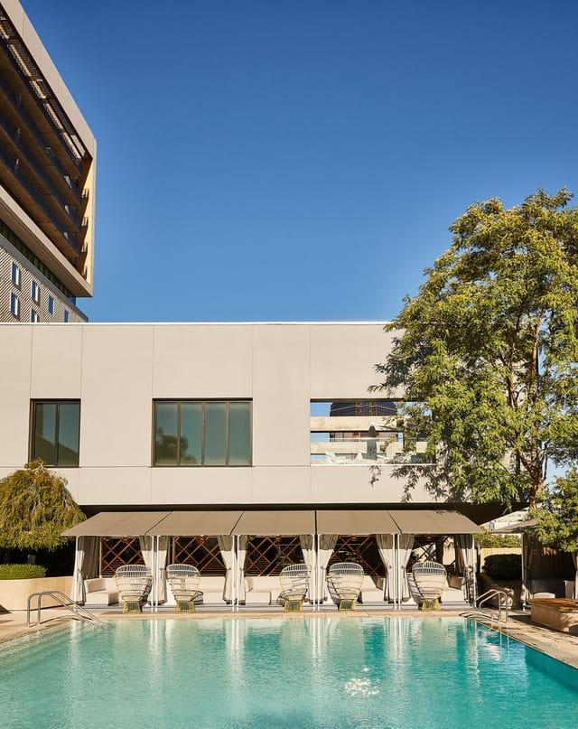 Revival Lounge in Kimpton Sawyer Hotel, modern venue for events with natural light and greenery.