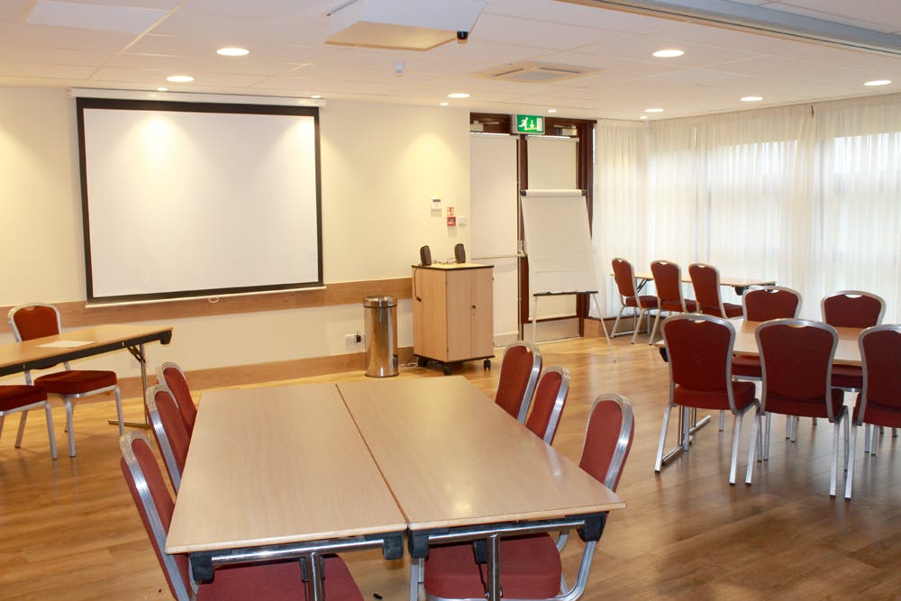 Versatile meeting room at The Rectory, ideal for workshops and presentations.