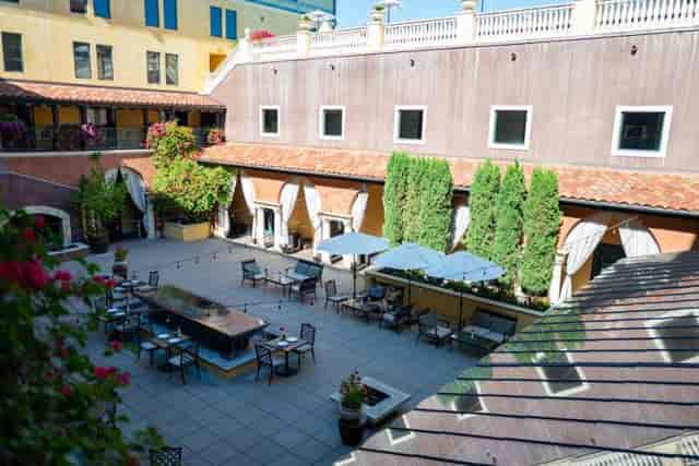 Outdoor event venue at Hotel Valencia Santana Row with stylish seating and lush greenery.