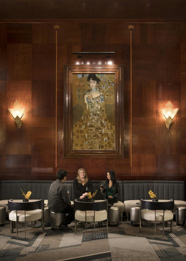Intimate lounge with warm wood decor, perfect for networking events and meetings.