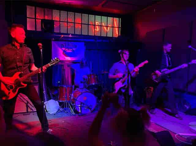 "Live band performance at Ivy Room, vibrant atmosphere for events and networking."
