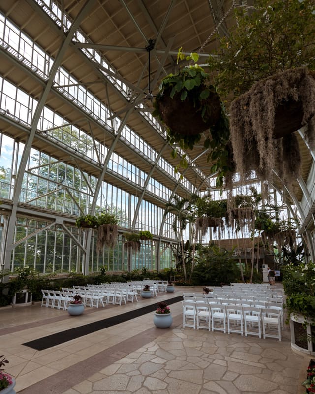 Jewel Box venue with glass walls and lush greenery, perfect for weddings and retreats.