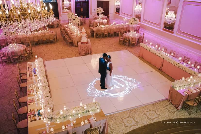 Elegant wedding reception at Grand Marquise Ballroom with romantic lighting and floral decor.