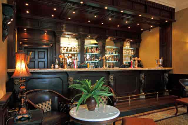 Spring Grove House bar with elegant woodwork, ideal for networking events and meetings.