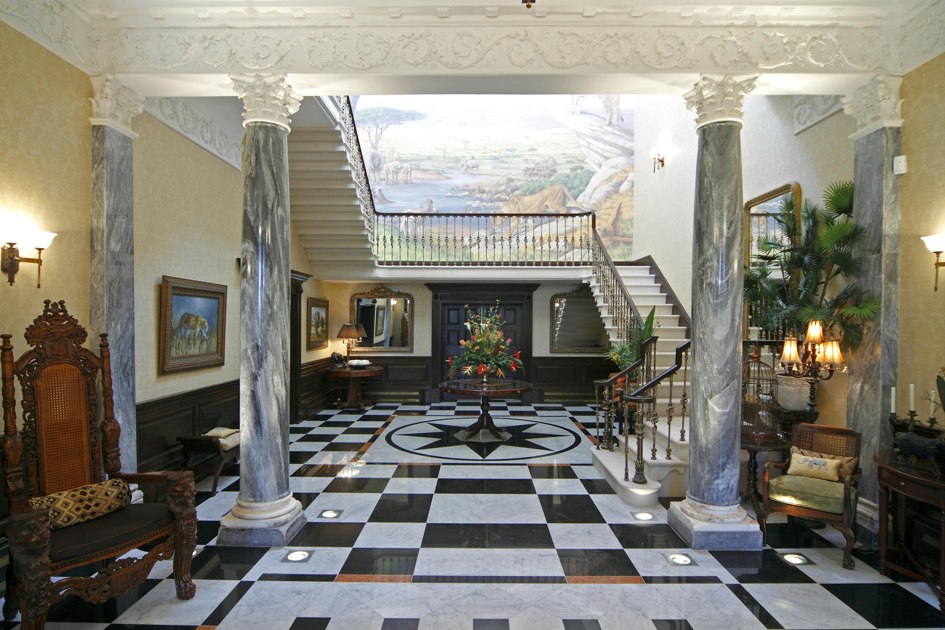 Elegant foyer with grand staircase at Spring Grove House, ideal for events and receptions.