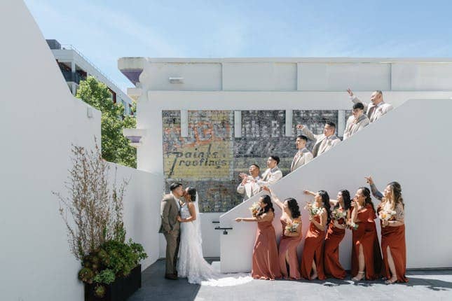 Vibrant wedding couple on Blanco Urban Venue's stylish rooftop terrace.