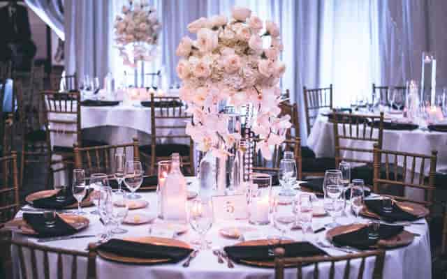 Elegant banquet table with floral centerpiece in Napredak Hall for sophisticated events.