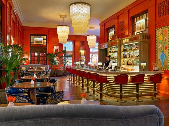 Cocktail bar at The Coral Room with stylish decor, ideal for networking events and gatherings. - Banner