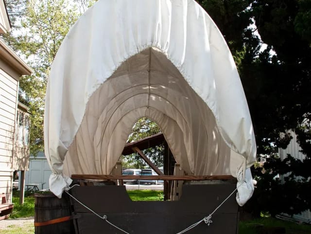 Creek Overlook Pavilion with rustic covered wagon for San José outdoor events.