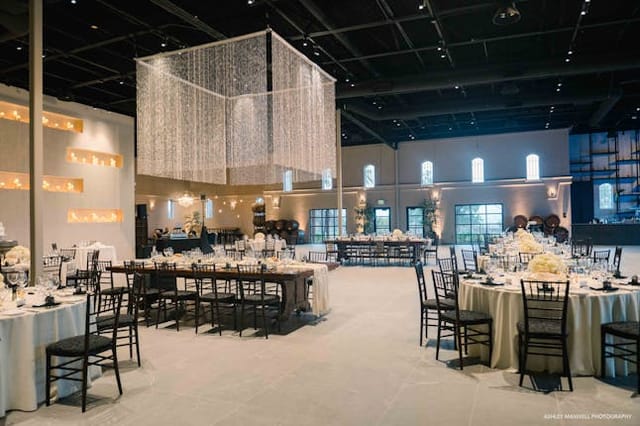 Elegant ballroom with round tables, perfect for weddings and corporate events.