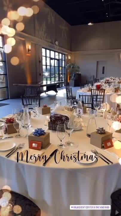 Elegant banquet hall setup with gift boxes for a festive event at Palm Event Center.