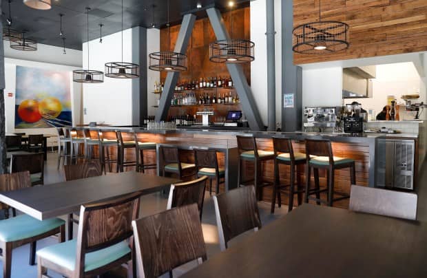 Private dining room at Scott's Seafood with sleek bar, ideal for social events and gatherings.