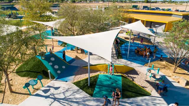 Vibrant park area with shade structures for community events and family gatherings.